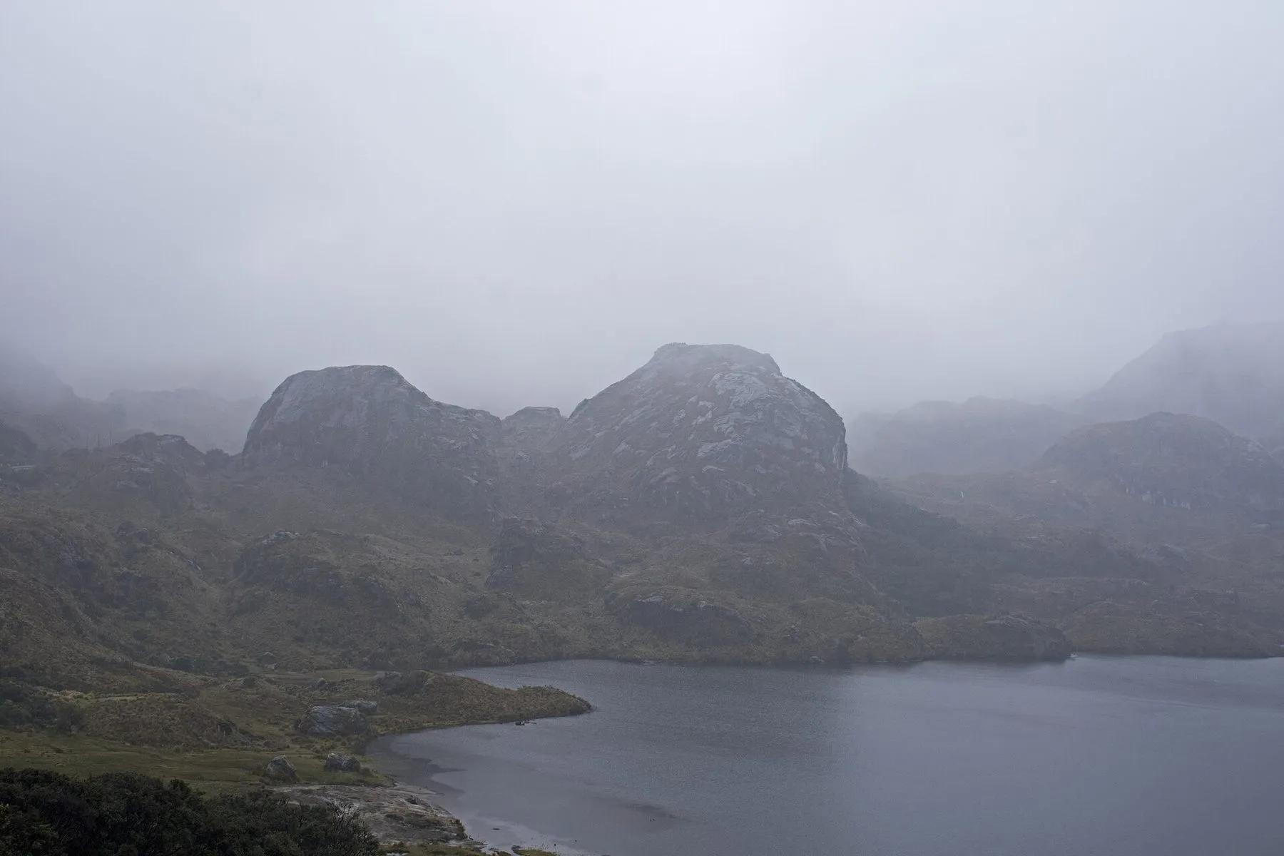 Laguna Toreadora in the rain, from a viewpoint in El Cajas National Park