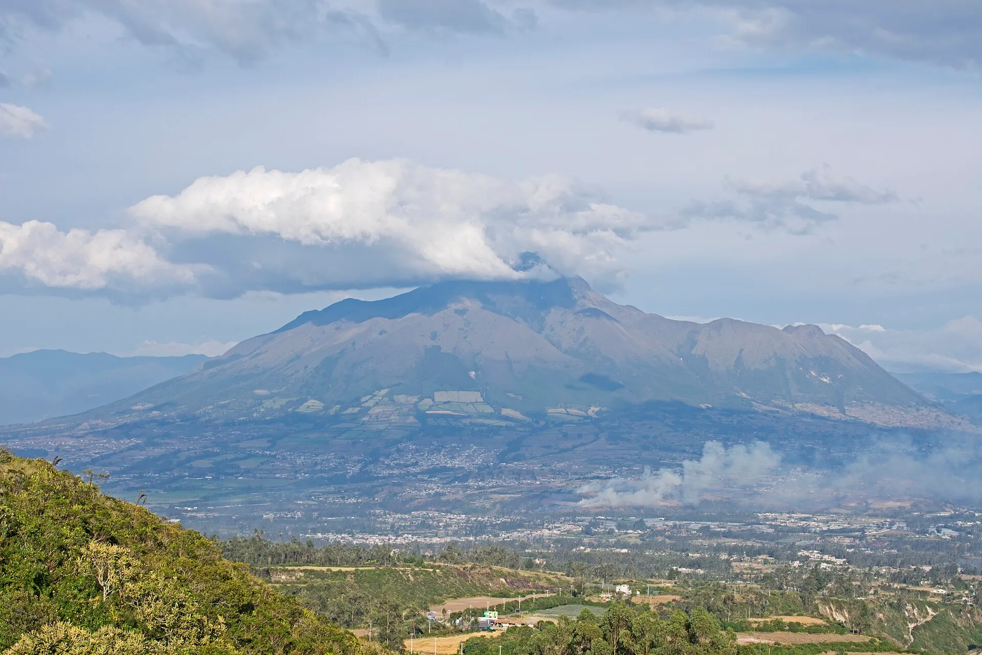 Cuicocha crater lake with the Imbabura volcano behind it
