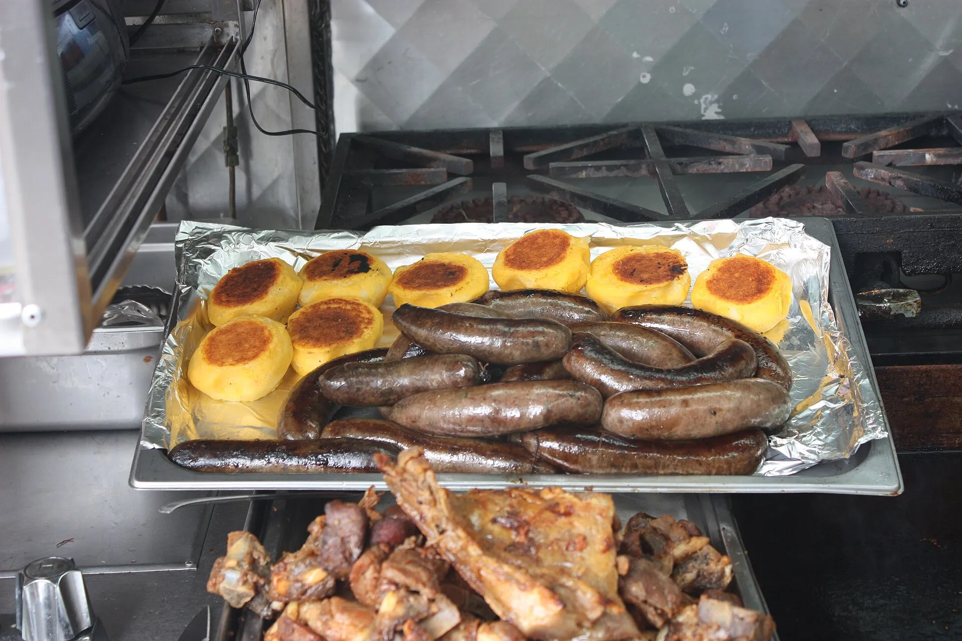 Llapingachos, Ecuadorian potato patties, with egg and salad