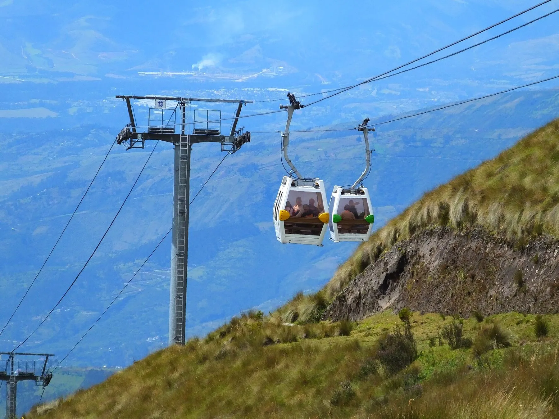 Gondolas of the TelefériQo climbing the slope of Pichincha above Quito